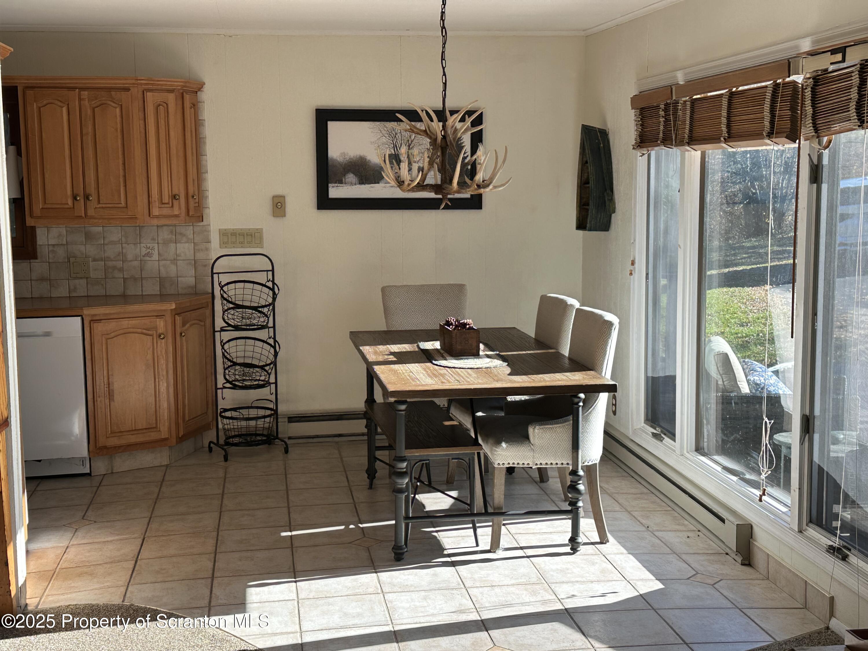25 Fall Place Union Dale, PA 18470 - Photo 7 of 27 a table and chairs in a kitchen
