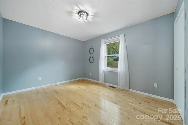 a view of empty room with windows