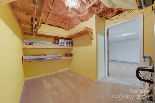 a view of a room with wooden walls