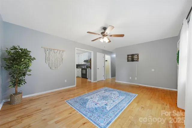 a view of a house with a yard and a garden