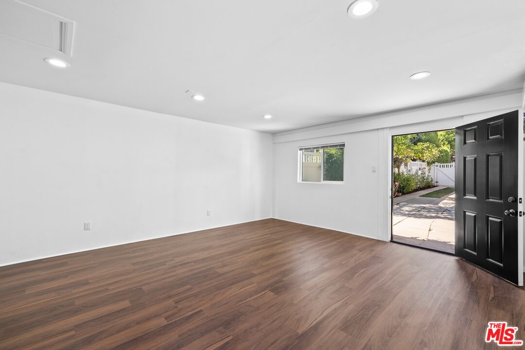 910 North Bushnell Avenue Alhambra, CA 91801 - Photo 20 of 23 a view of an empty room with wooden floor and a window