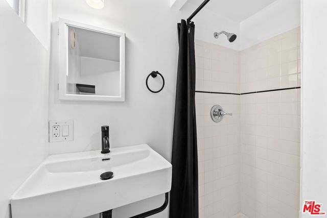 a bathroom with a sink and mirror