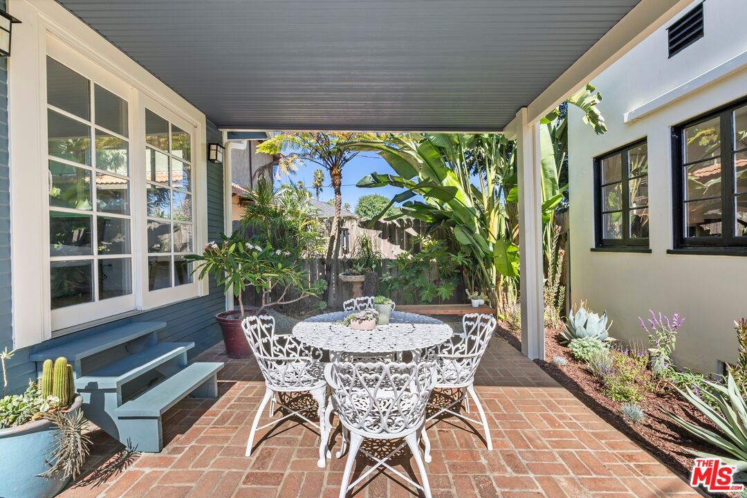 910 North Bushnell Avenue Alhambra, CA 91801 - Photo 22 of 23 a view of outdoor dining space with a table and chairs