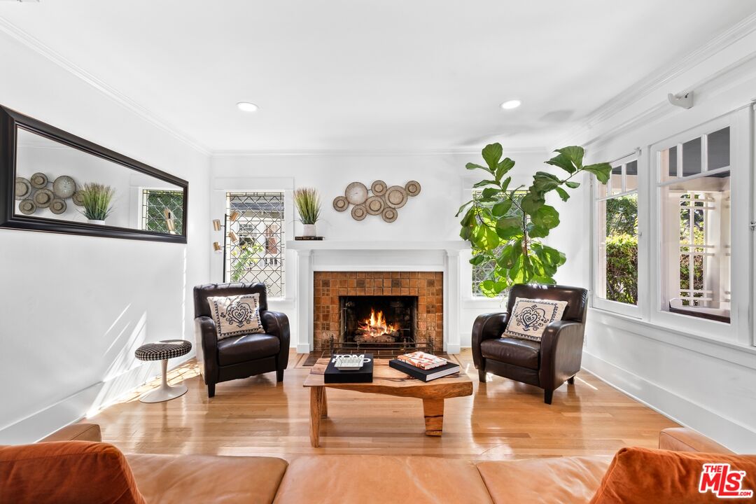 910 North Bushnell Avenue Alhambra, CA 91801 - Photo 4 of 23 a living room with furniture and a fireplace