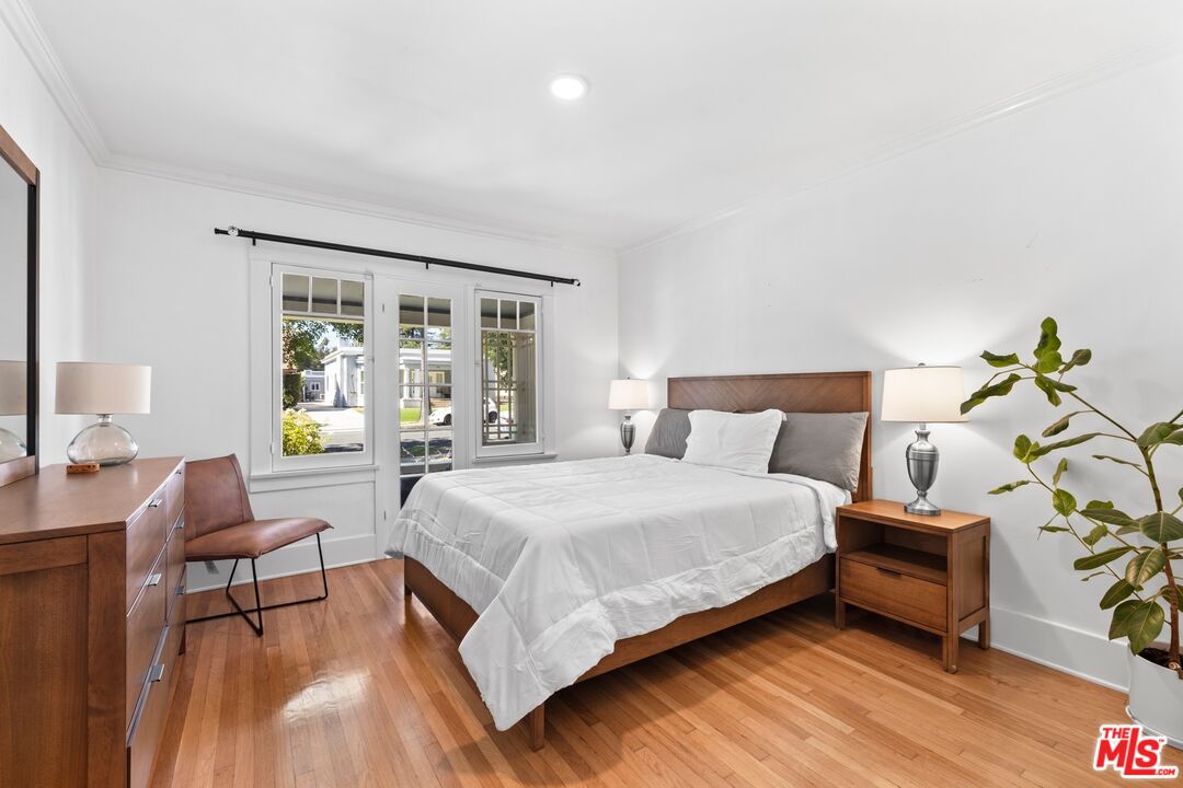910 North Bushnell Avenue Alhambra, CA 91801 - Photo 7 of 23 a spacious bedroom with a bed and a couch