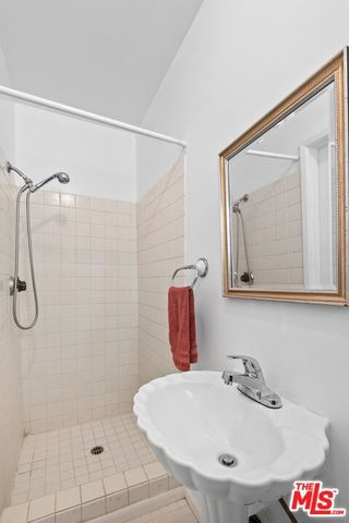 a bathroom with a sink and shower