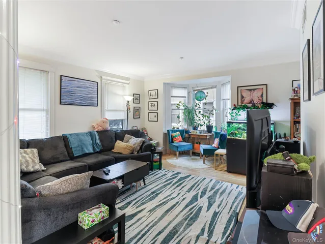 a living room with furniture and a window