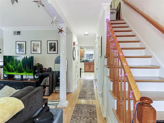 a view of a hallway with furniture and entryway