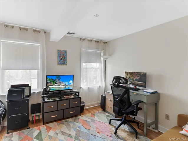a room with furniture and flat screen tv