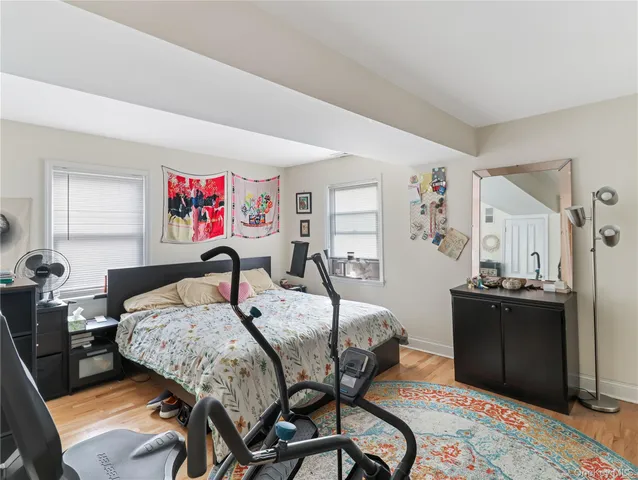 a bedroom with a bed and dresser