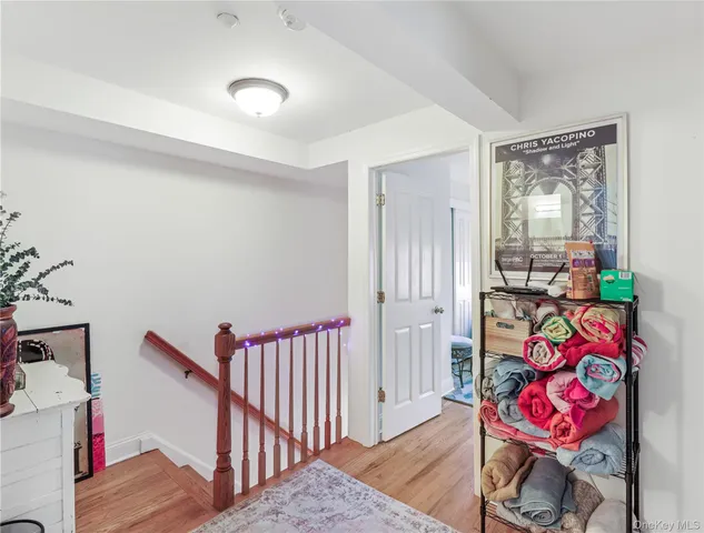 a bedroom with furniture and a book shelf