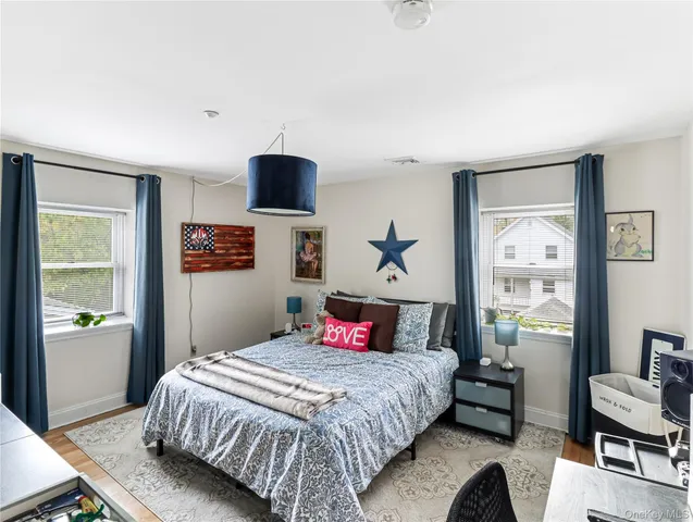 a bedroom with a large bed and a window