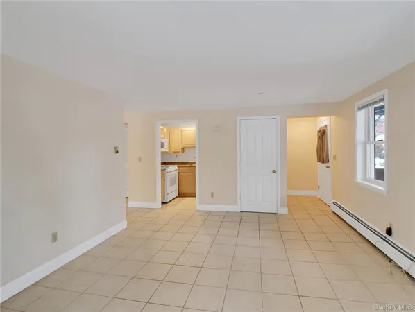 a view of an empty room with glass door