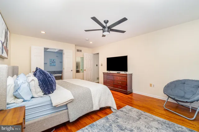 a bedroom with a bed and a television in it