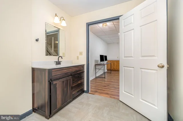 a bathroom with a sink and a mirror