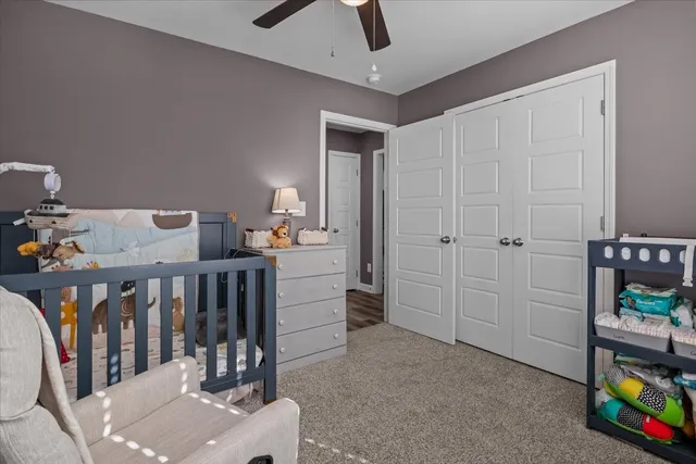 a bedroom with furniture and a window