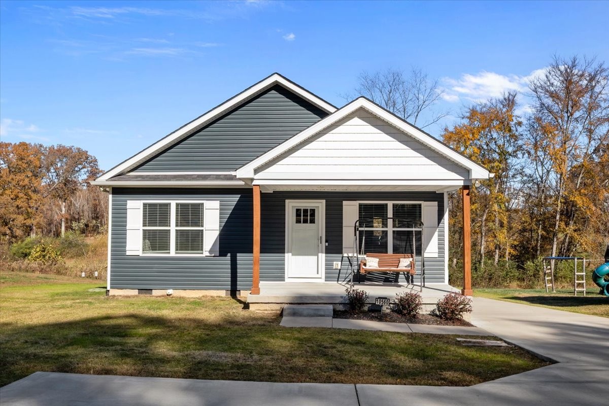 10560 Church Road Bon Aqua, TN 37025 - Photo 2 of 21 front view of a house with a yard