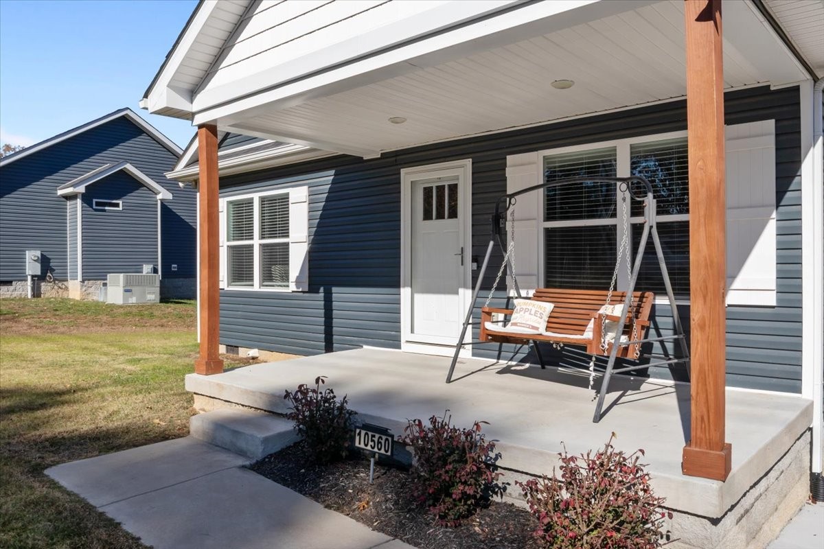 10560 Church Road Bon Aqua, TN 37025 - Photo 3 of 21 a view of a patio with table and chairs and wooden fence