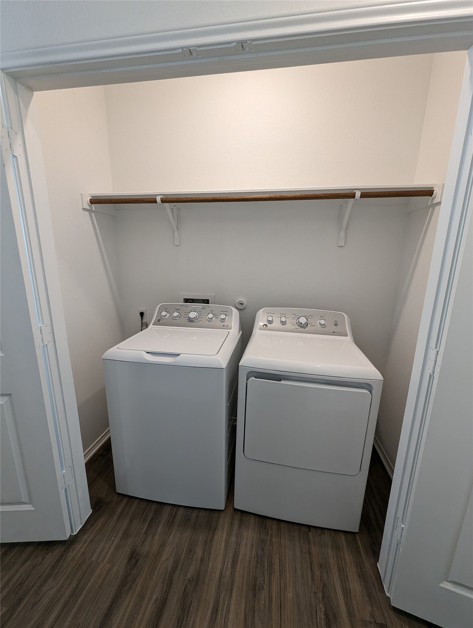 361 Soapstone Pass Maxwell, TX 78656 - Photo 13 of 17 a utility room with wooden floor washer and dryer