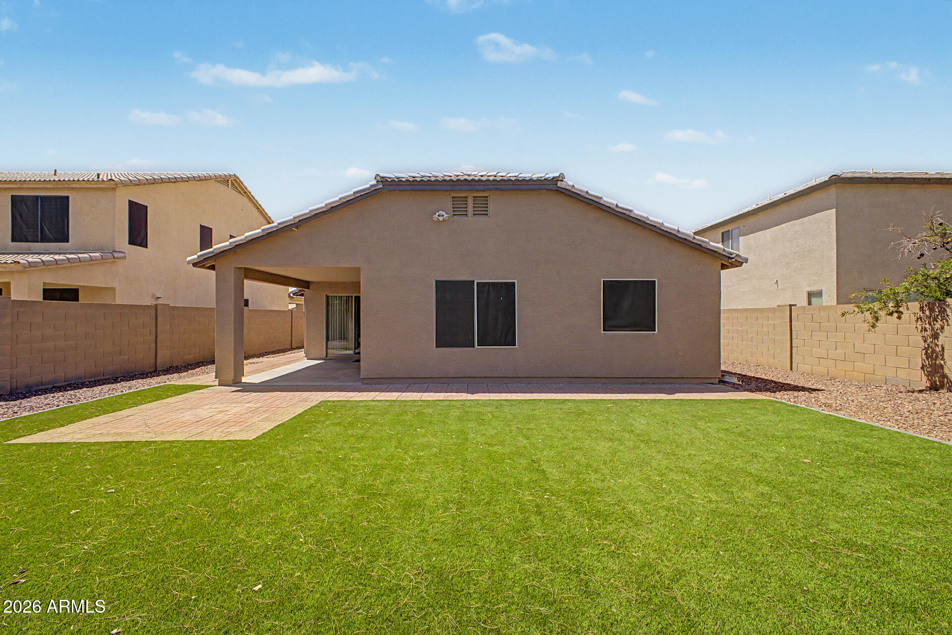 2340 West Apollo Road Phoenix, AZ 85041 - Photo 22 of 26 a backyard of a house with table and chairs