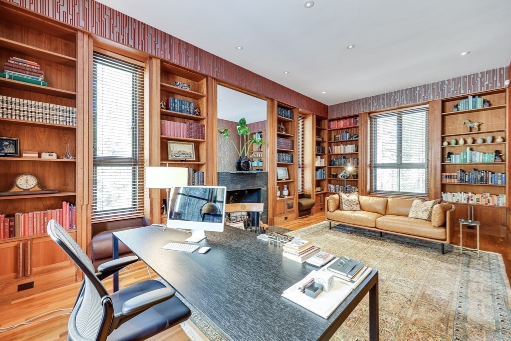 75 Buttricks Hill Drive Concord, MA 01742 - Photo 15 of 24 a living room with furniture a bookshelf and a large window