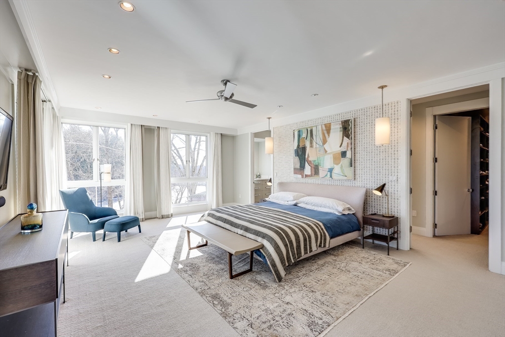 75 Buttricks Hill Drive Concord, MA 01742 - Photo 16 of 24 a spacious bedroom with a large bed and a large window