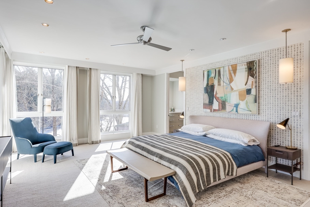 75 Buttricks Hill Drive Concord, MA 01742 - Photo 17 of 24 a bedroom with a bed and a large window