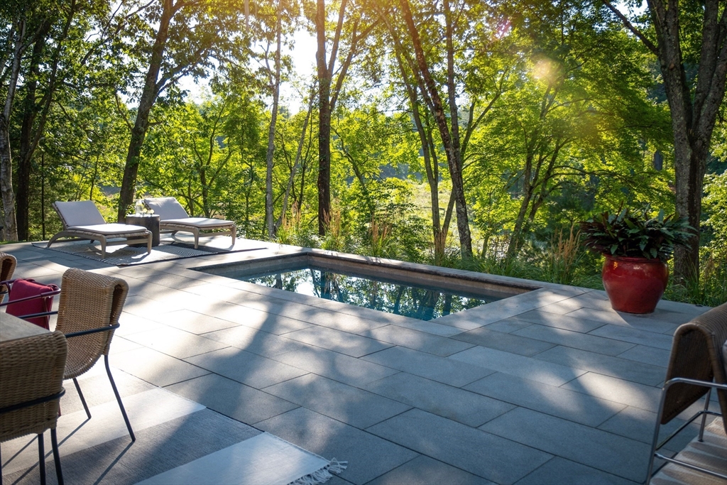 75 Buttricks Hill Drive Concord, MA 01742 - Photo 19 of 24 a view of a chairs and table in the patio