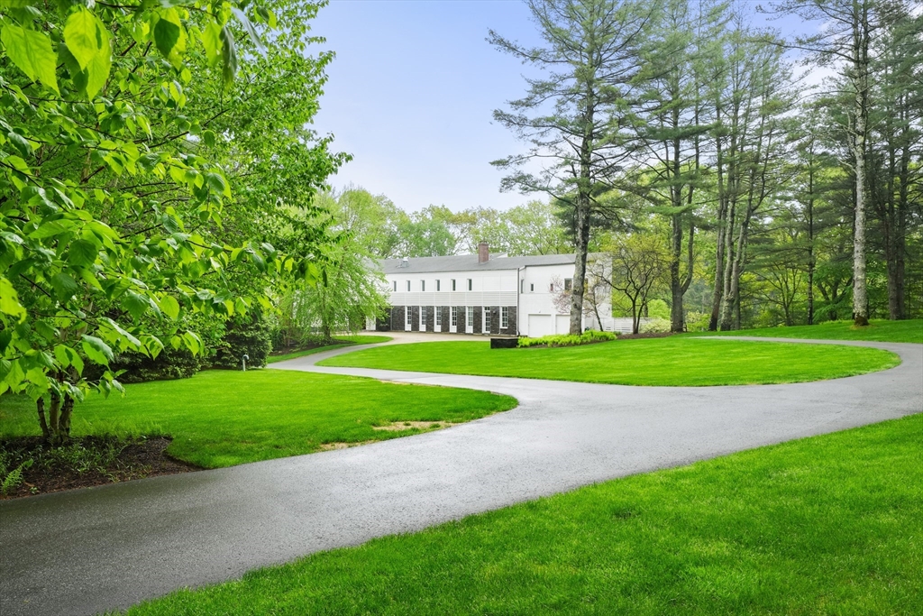 75 Buttricks Hill Drive Concord, MA 01742 - Photo 2 of 24 a view of a park with large trees