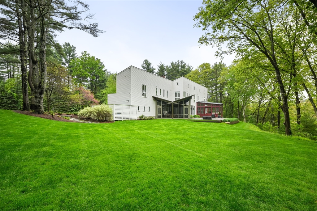 75 Buttricks Hill Drive Concord, MA 01742 - Photo 23 of 24 a view of a house with backyard and garden