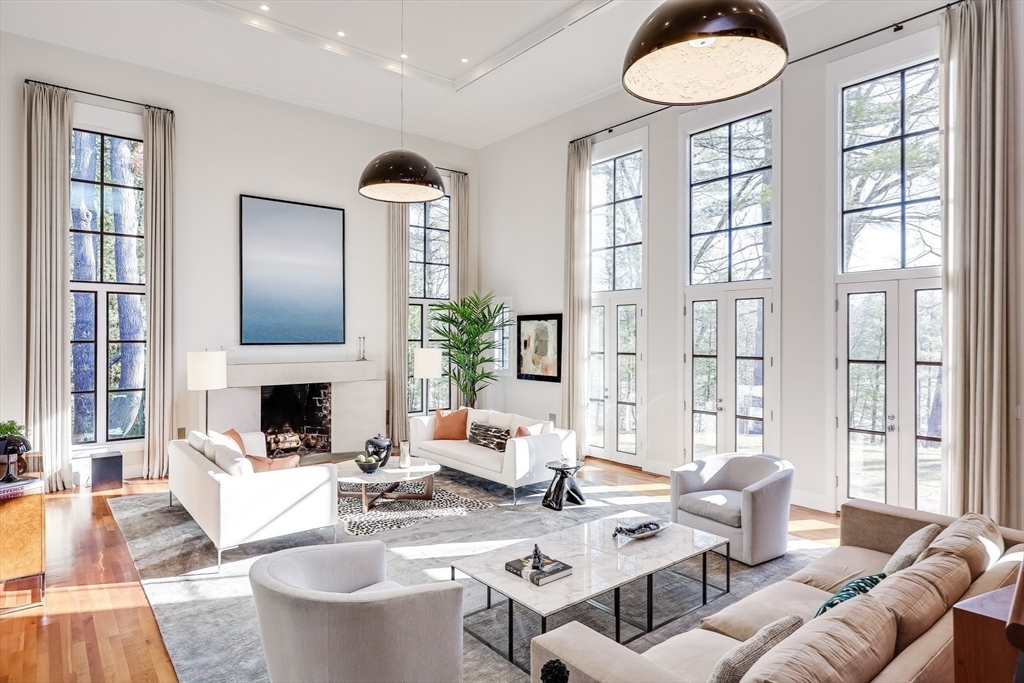 75 Buttricks Hill Drive Concord, MA 01742 - Photo 3 of 24 a living room with fireplace furniture and a large window