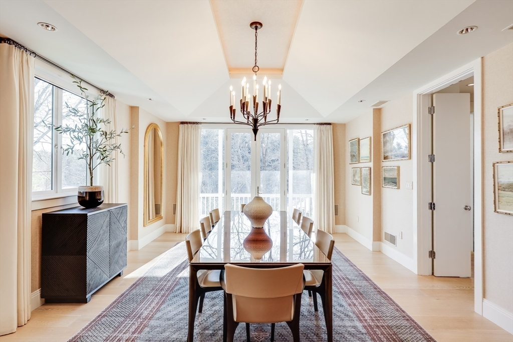75 Buttricks Hill Drive Concord, MA 01742 - Photo 7 of 24 a view of a dining room with furniture wooden floor and chandelier