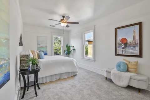 a bathroom with a toilet and a shower curtain