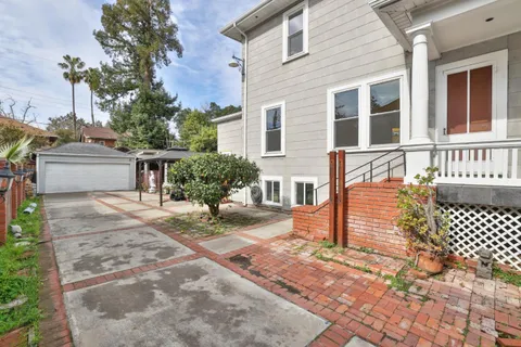 a house view with a sitting space and garden