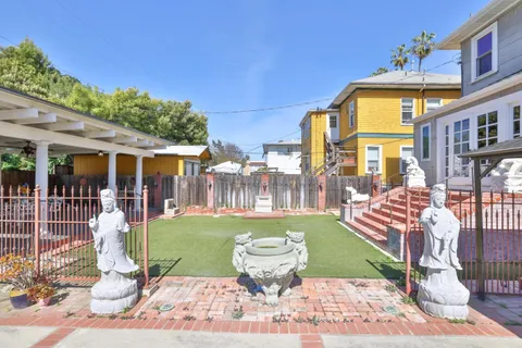 an aerial view of a house with outdoor space