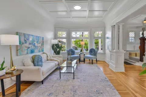 a living room with furniture and a rug