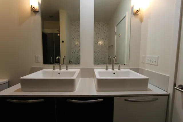 a bathroom with a sink and a mirror