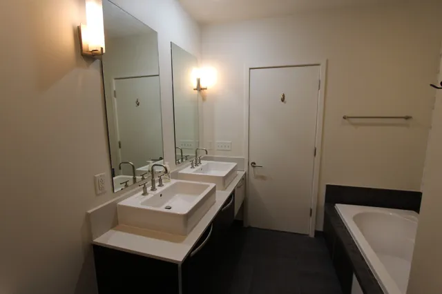 a bathroom with a sink and a mirror
