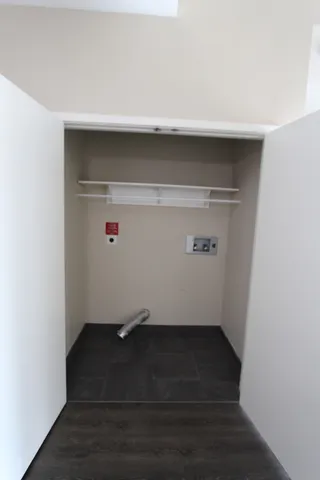 an empty room with wooden floor