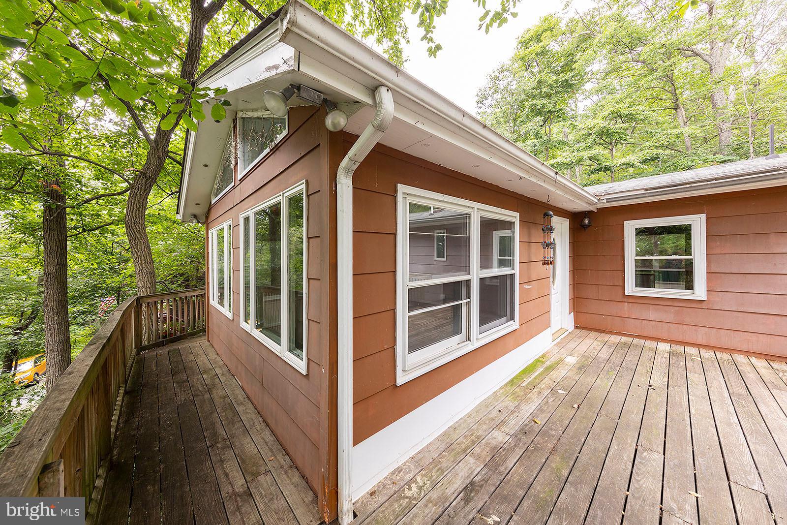 114 Inca Trail Winchester, VA 22602 - Photo 12 of 44 a view of a house with a large window and wooden fence
