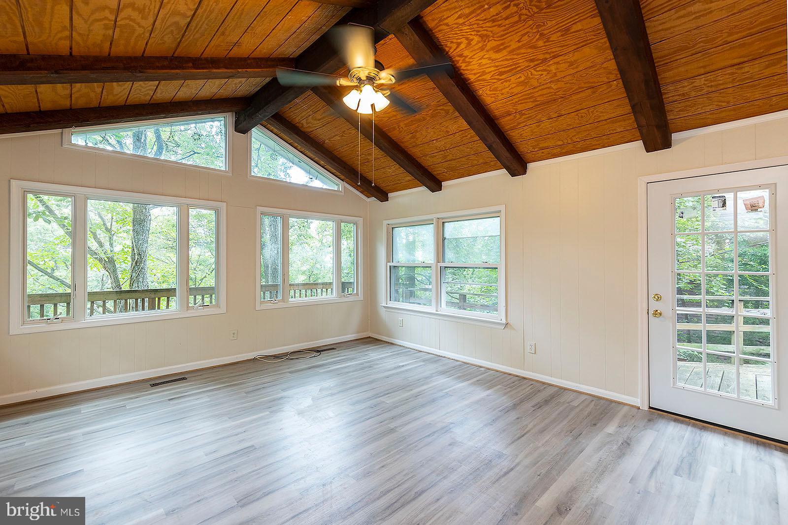 114 Inca Trail Winchester, VA 22602 - Photo 20 of 44 a view of an empty room with wooden floor and a window