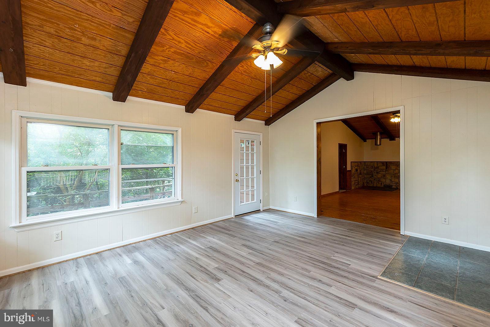 114 Inca Trail Winchester, VA 22602 - Photo 21 of 44 a view of an empty room with wooden floor and a window