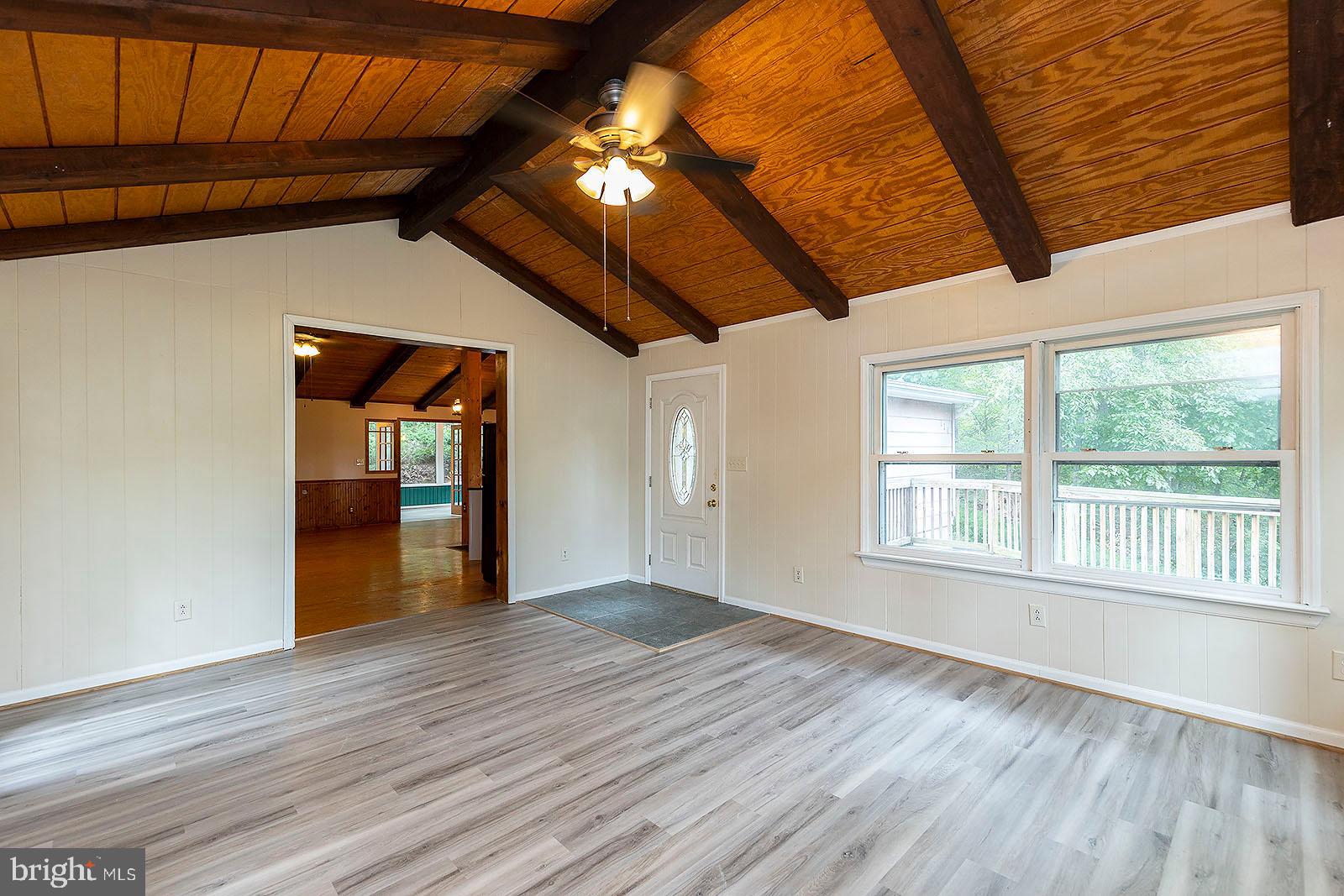 114 Inca Trail Winchester, VA 22602 - Photo 22 of 44 an empty room with wooden floor and windows