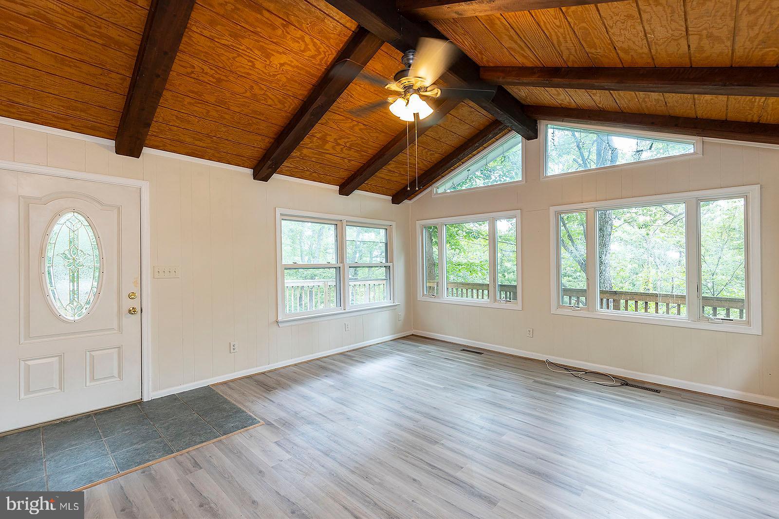 114 Inca Trail Winchester, VA 22602 - Photo 23 of 44 an empty room with wooden floor and windows
