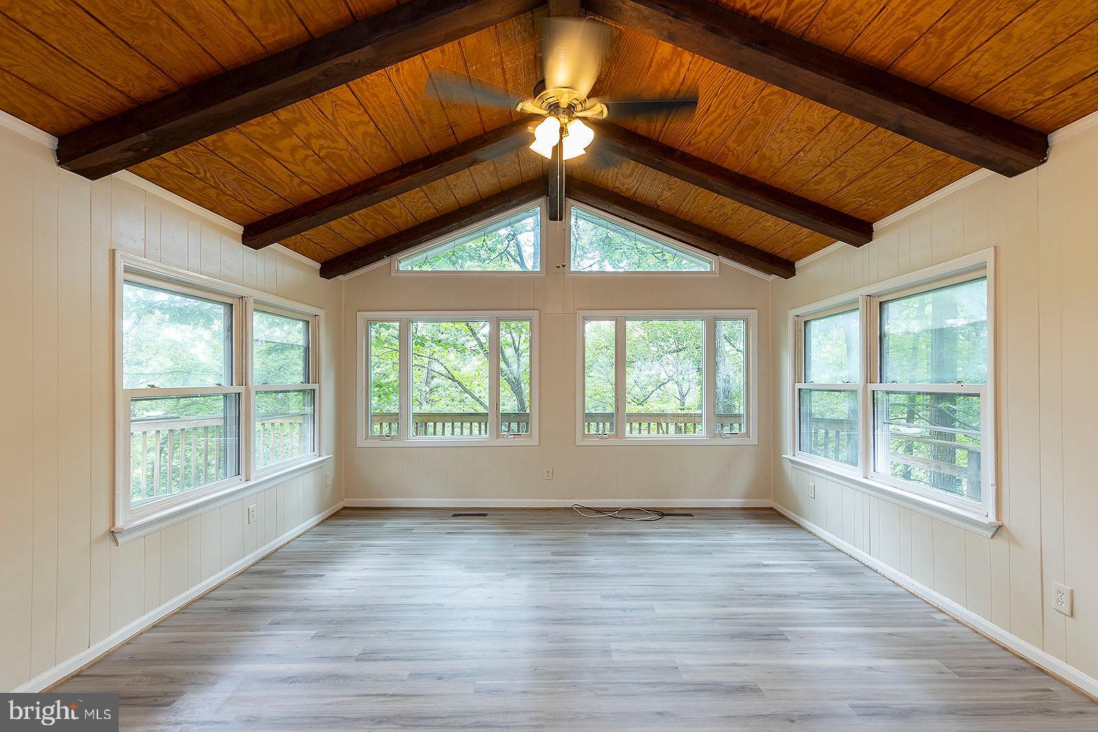114 Inca Trail Winchester, VA 22602 - Photo 24 of 44 an empty room with wooden floor and windows