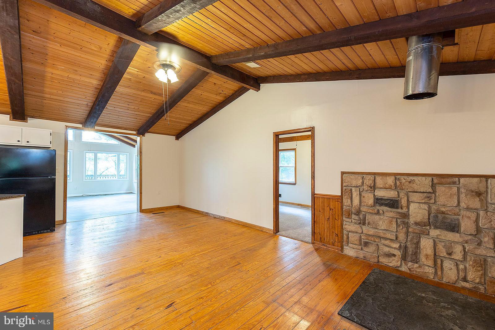 114 Inca Trail Winchester, VA 22602 - Photo 27 of 44 a view of an empty room with wooden floor and windows