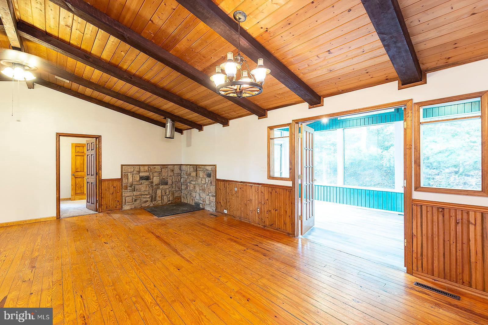 114 Inca Trail Winchester, VA 22602 - Photo 29 of 44 a view of an empty room with a window and wooden floor