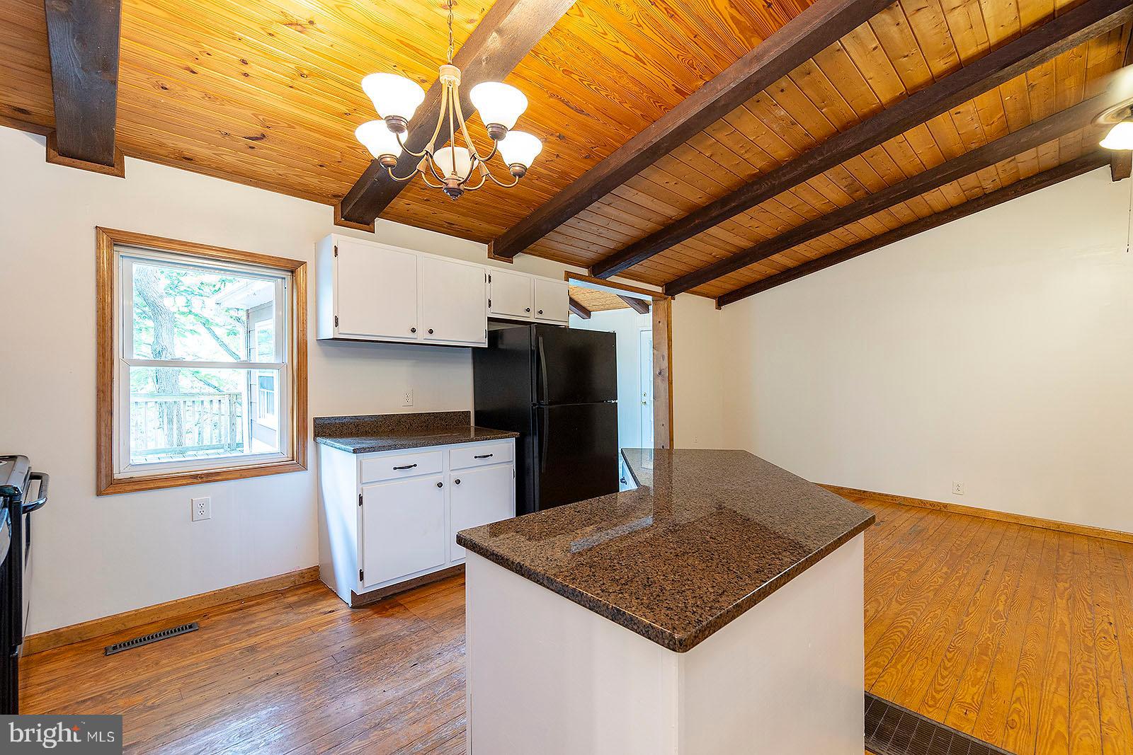 114 Inca Trail Winchester, VA 22602 - Photo 30 of 44 a kitchen with a stove a sink and a refrigerator