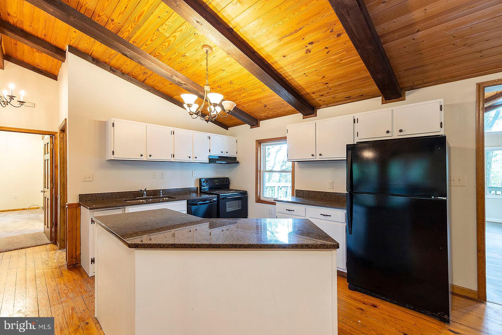 114 Inca Trail Winchester, VA 22602 - Photo 34 of 44 a kitchen with stainless steel appliances granite countertop a sink a refrigerator and a stove