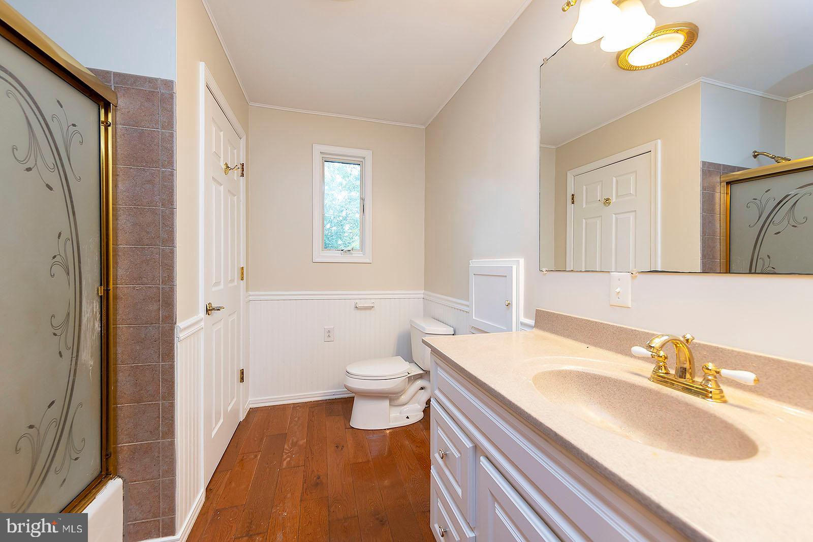 114 Inca Trail Winchester, VA 22602 - Photo 43 of 44 a bathroom with a sink a toilet and a mirror